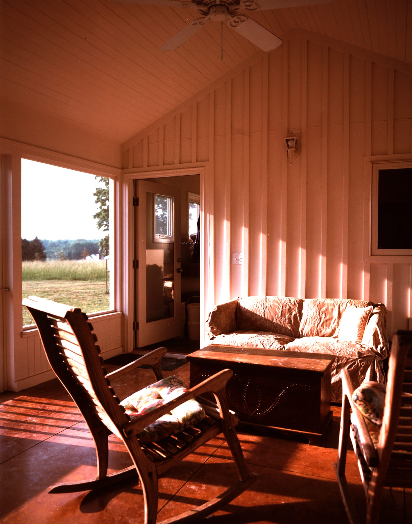 Cozy screen porch looking over the meadow