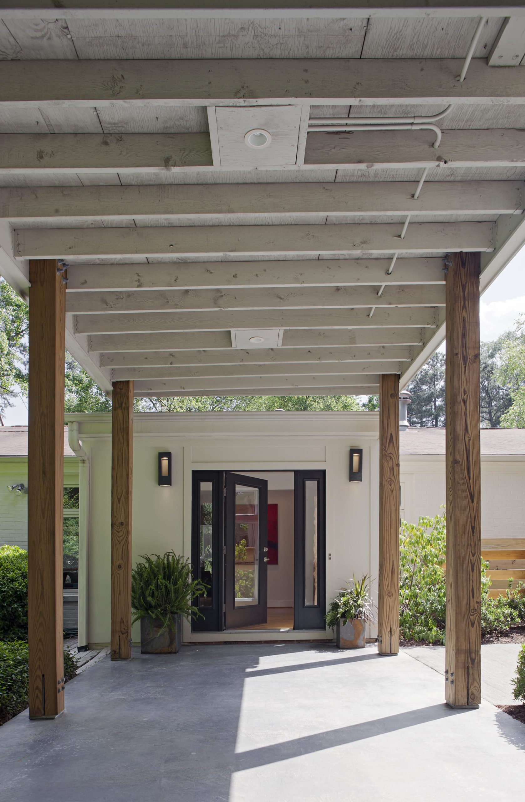 Colonnade covered walkway from car port to house entrance